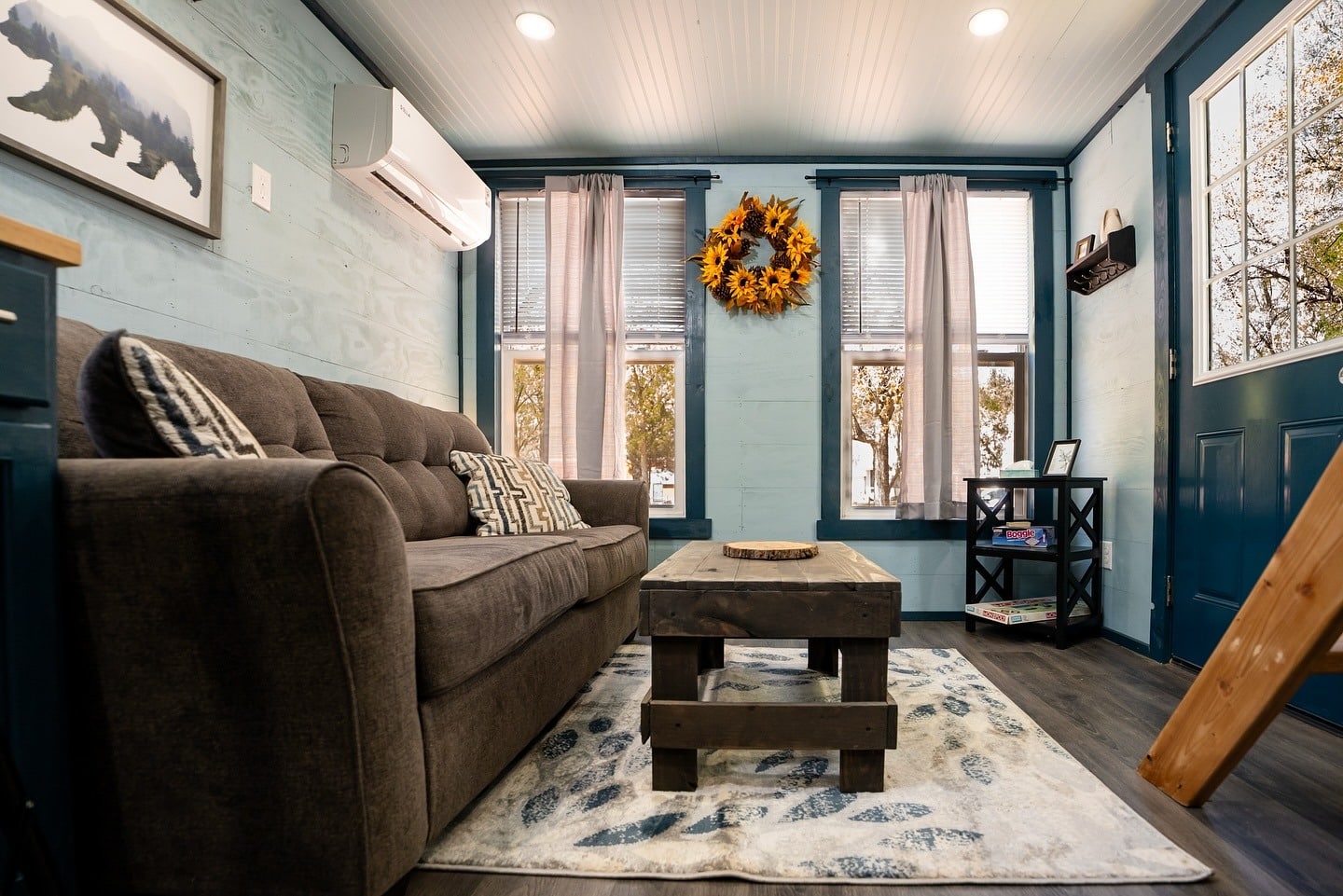 4. Rustic Comfort in Cool Blues - tiny house living room ideas
