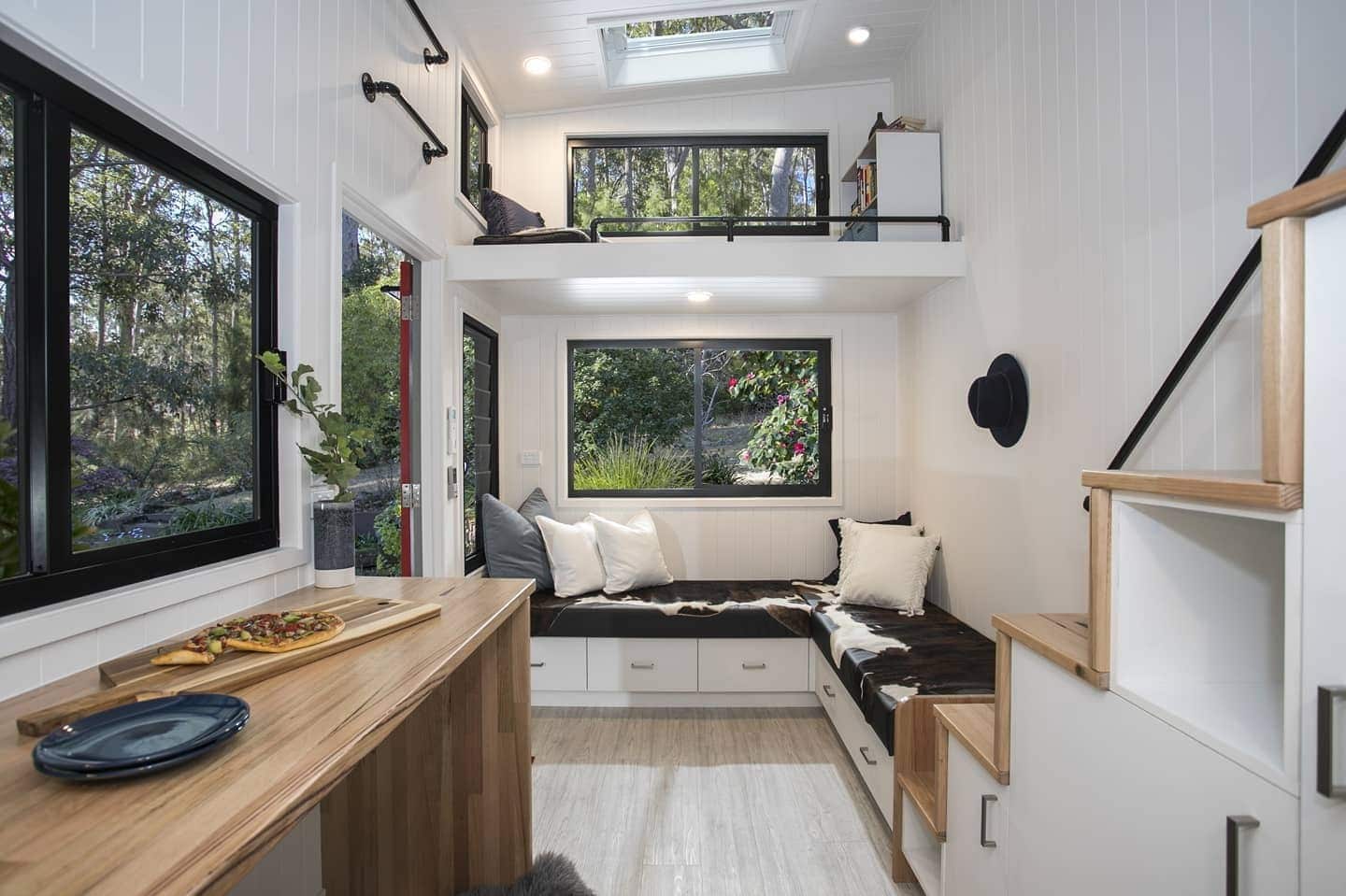 7. Compact L-Shaped Seating with Clever Storage - tiny house living room ideas