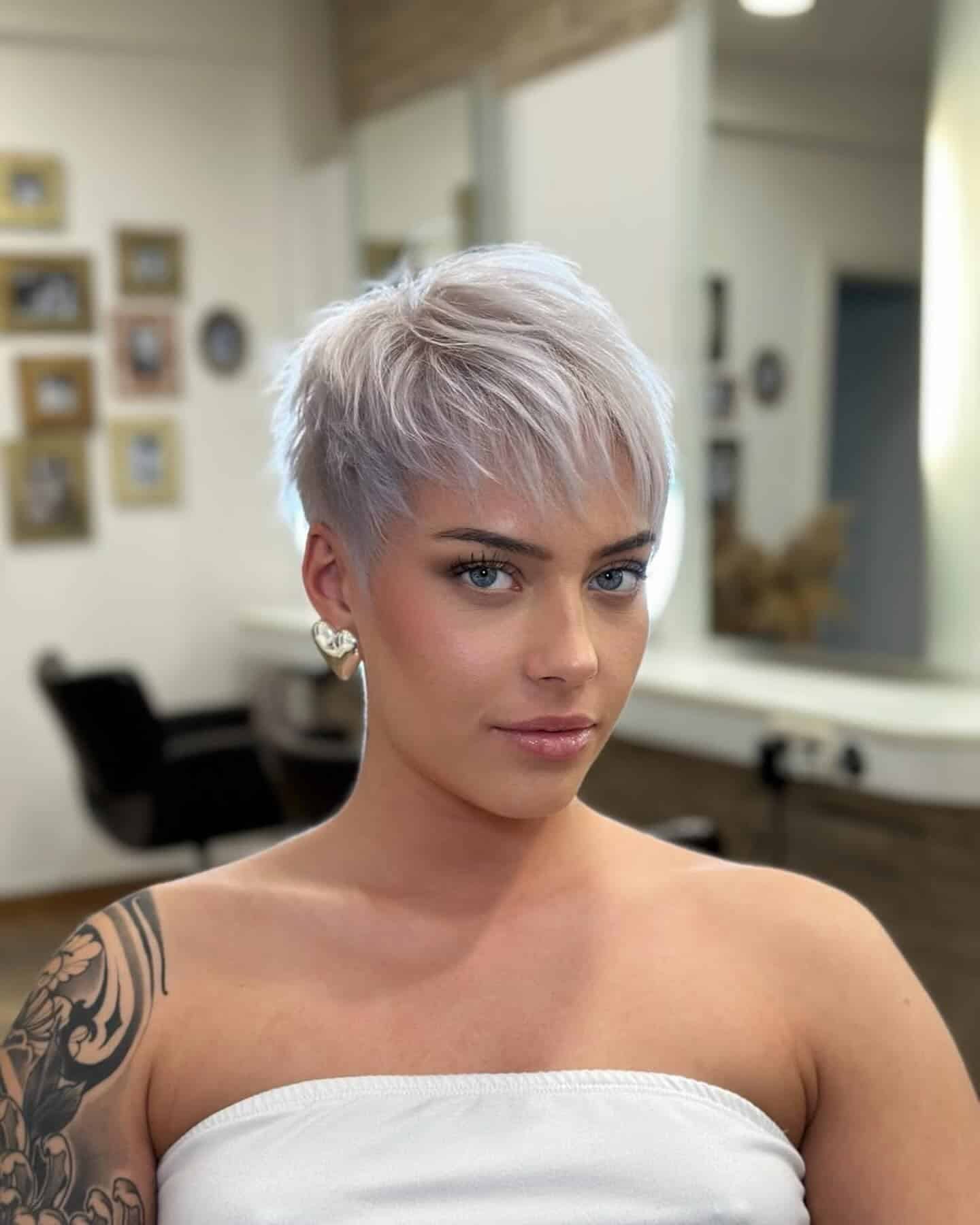 1. Platinum Pixie with Feathered Bangs - Pixie Haircuts With Bangs
