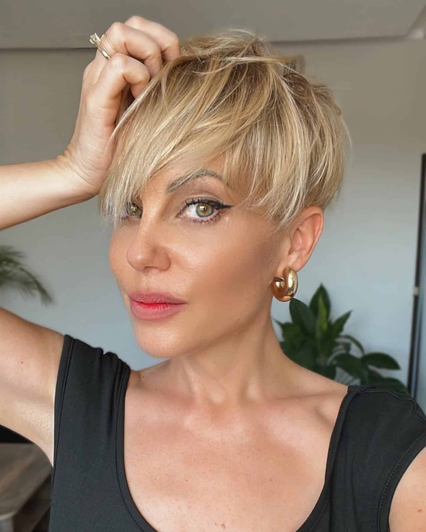 3. Golden Blonde Pixie with Side-Swept Bangs - Pixie Haircuts With Bangs