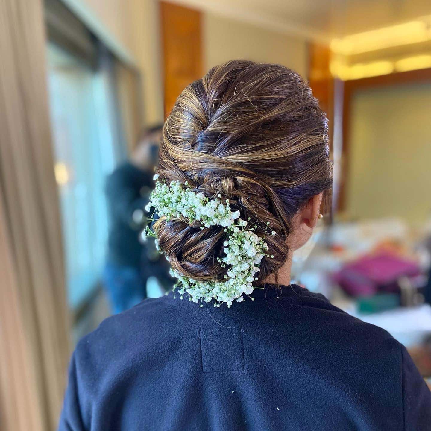 8. Braided Bun with Baby’s Breath Accents - Bun Hairstyles