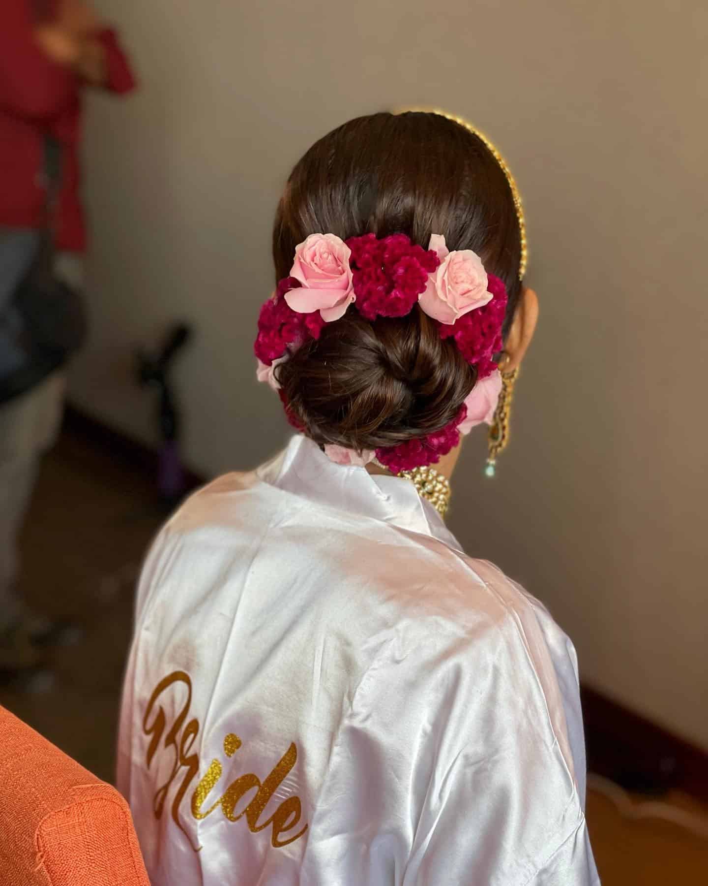 9. Elegant Bun with Red and Pink Roses - Bun Hairstyles