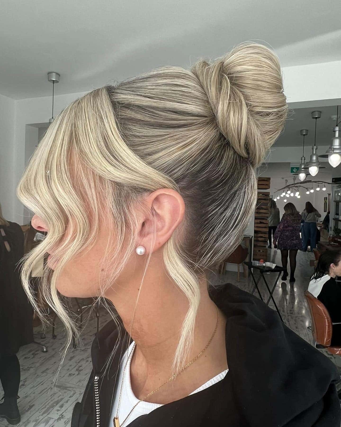 17. High Wrapped Bun with Loose Waves on Platinum Blonde Hair - Bun Hairstyles