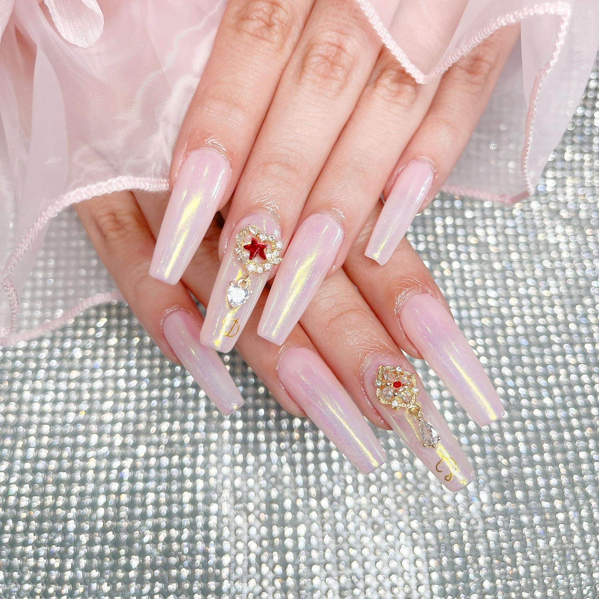 9. Iridescent Pink Coffin Nails with Charms - beautiful coffin nail ideas