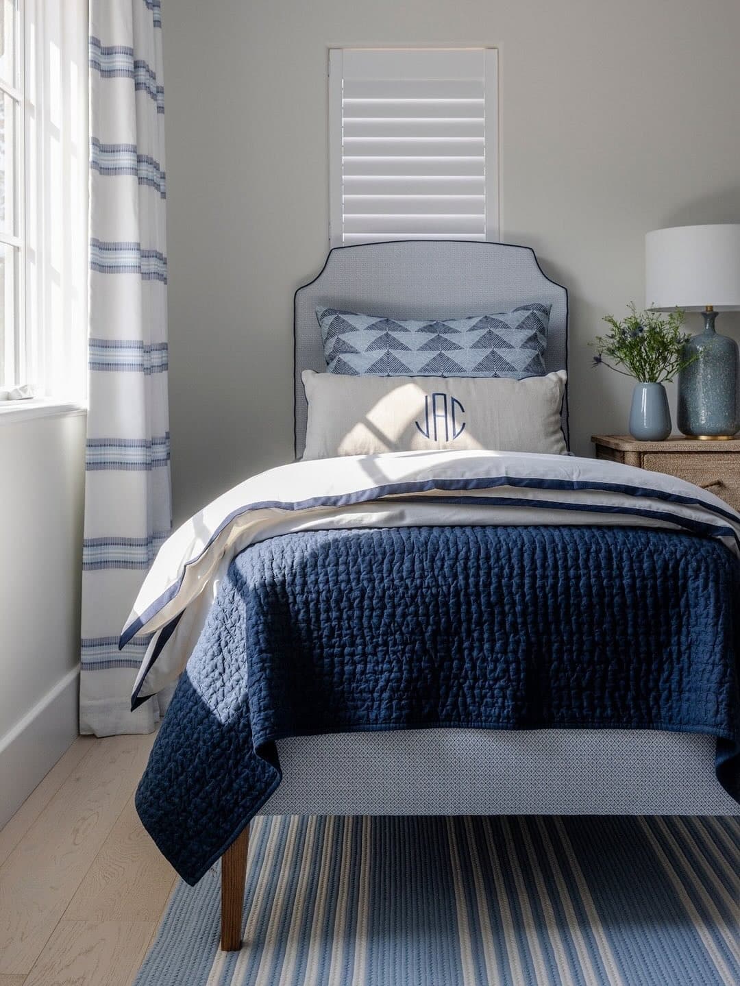 11. Coastal Freshness with Striped Accents - grey and blue bedroom ideas