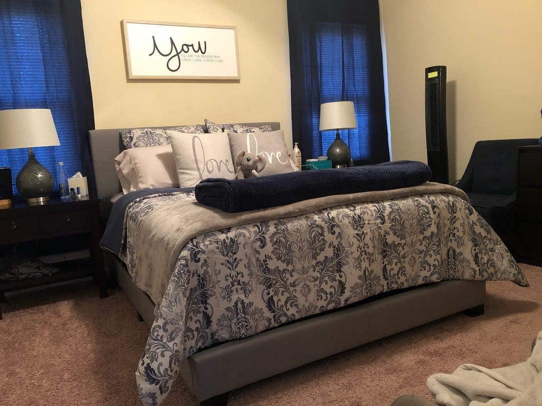16. Cozy Drama with Navy and Cream Patterns - grey and blue bedroom ideas