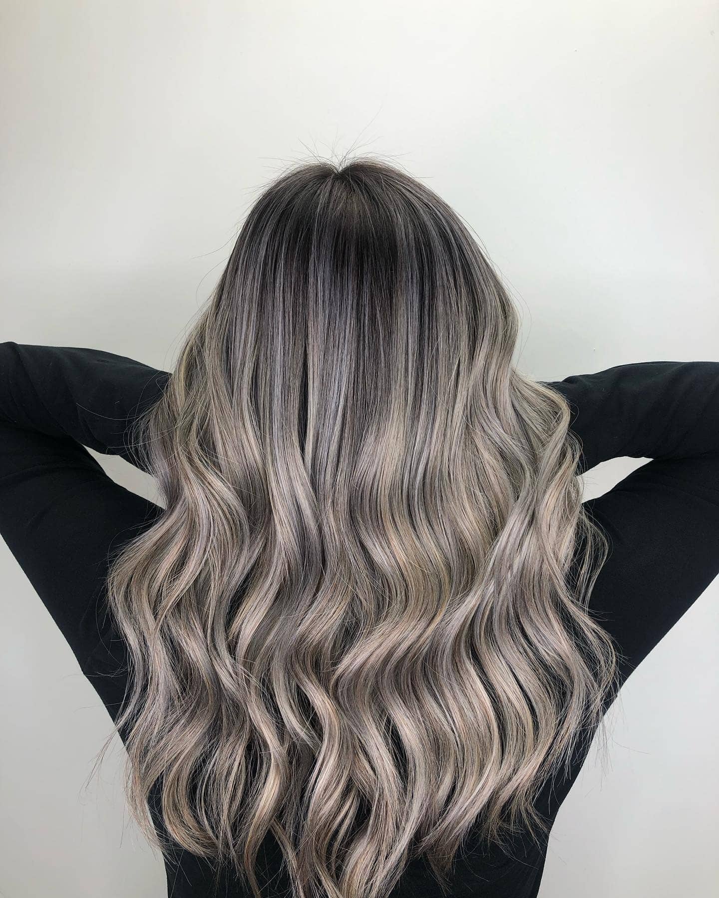 16. Ash Silver Waves with a Polished Finish - Ash Grey Hair Color