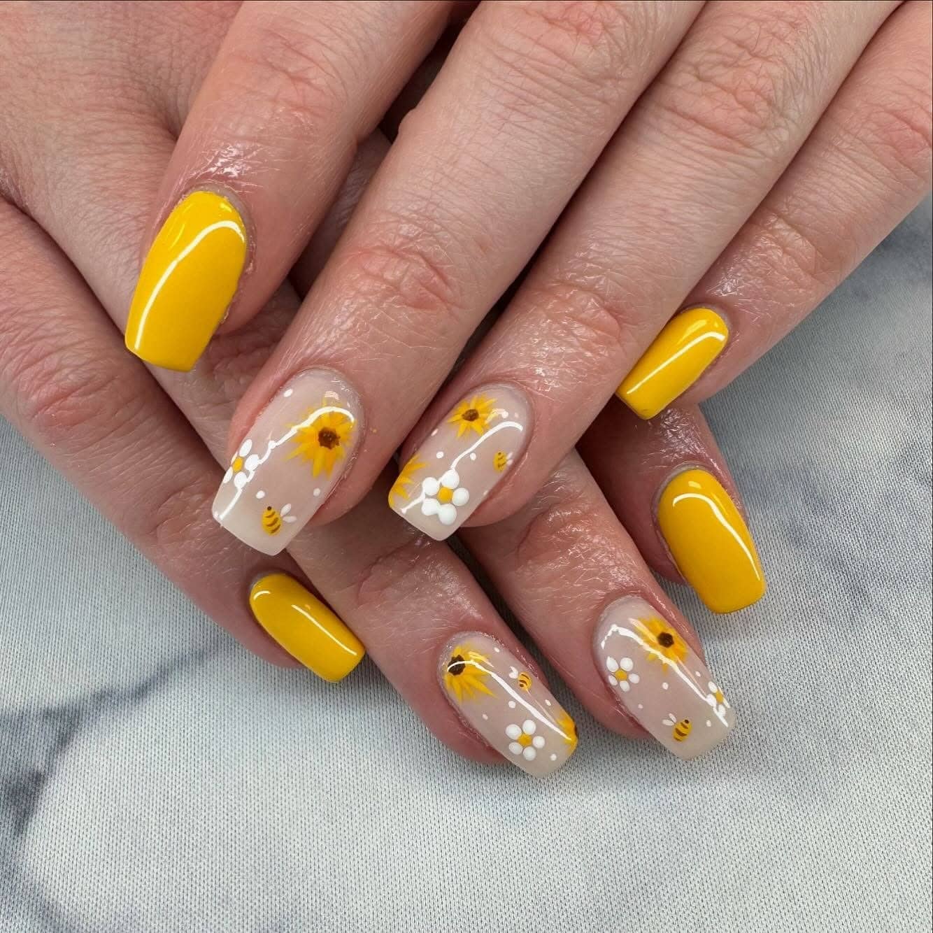 1. Sunny Bee Garden Nails with Yellow Accents - bee nail ideas