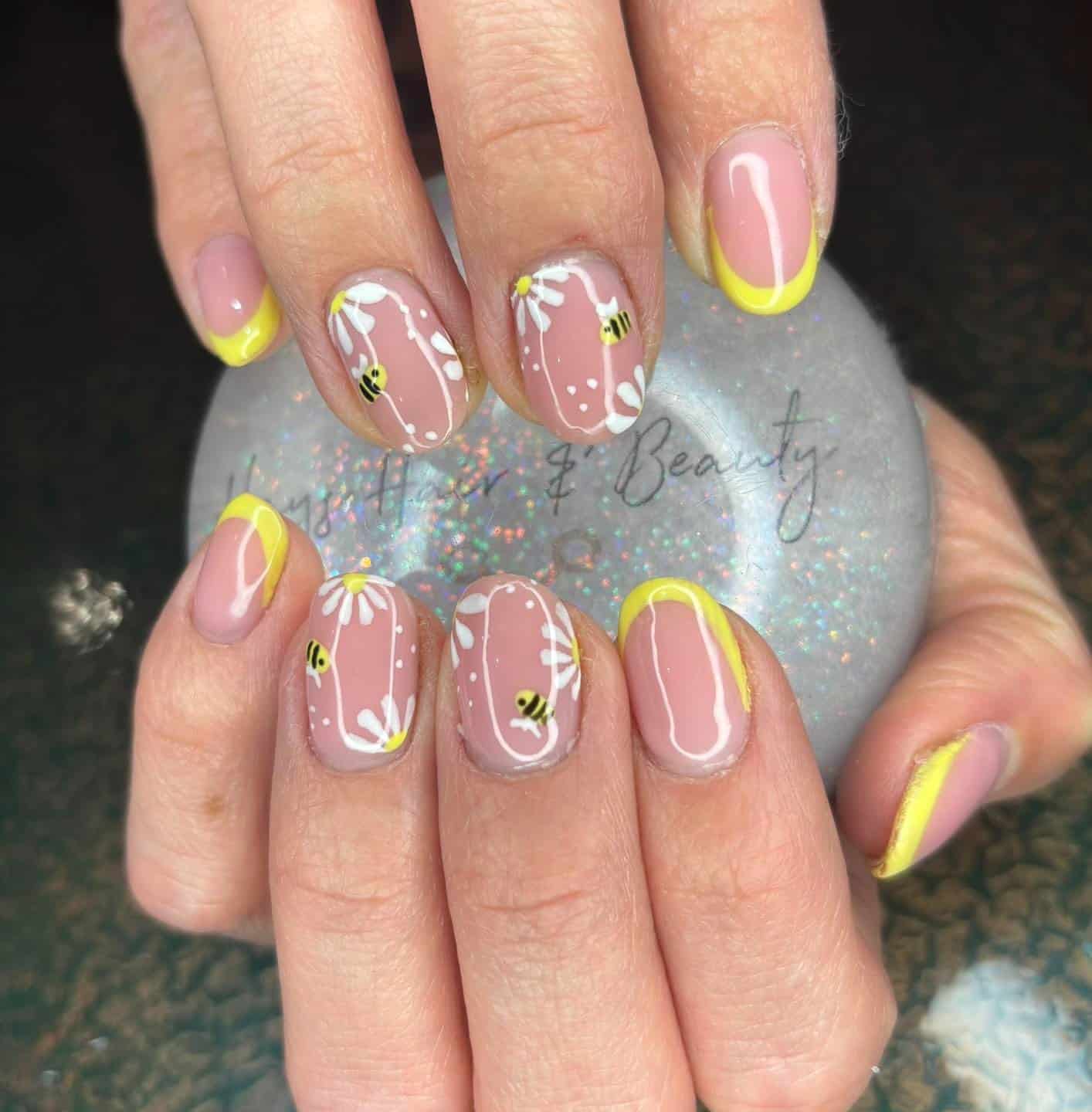 2. Bee French Tip Nails with Daisy Blooms - bee nail ideas