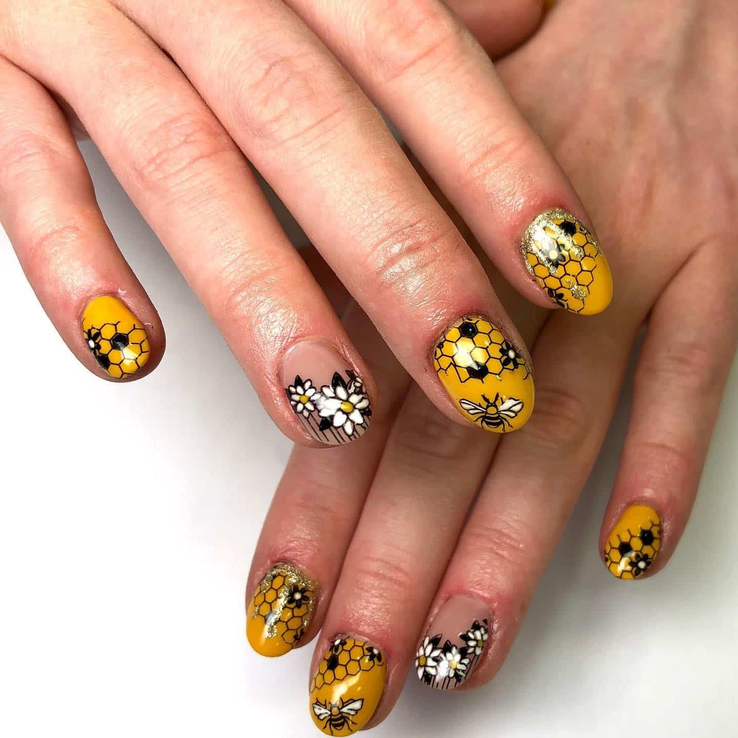 7. Bee and Bloom Honeycomb Nails - bee nail ideas
