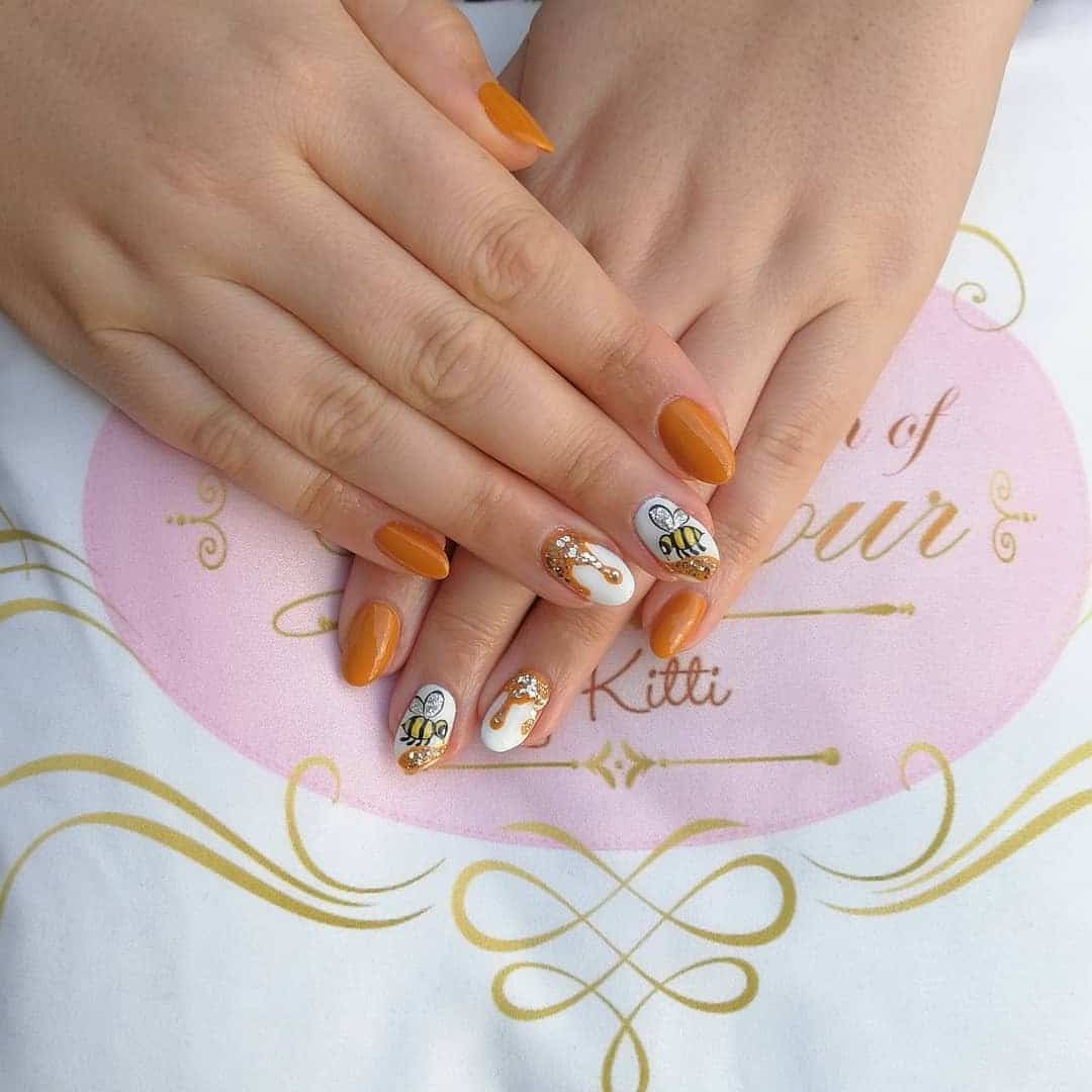13. Golden Honey Drip Bee Nails - bee nail ideas