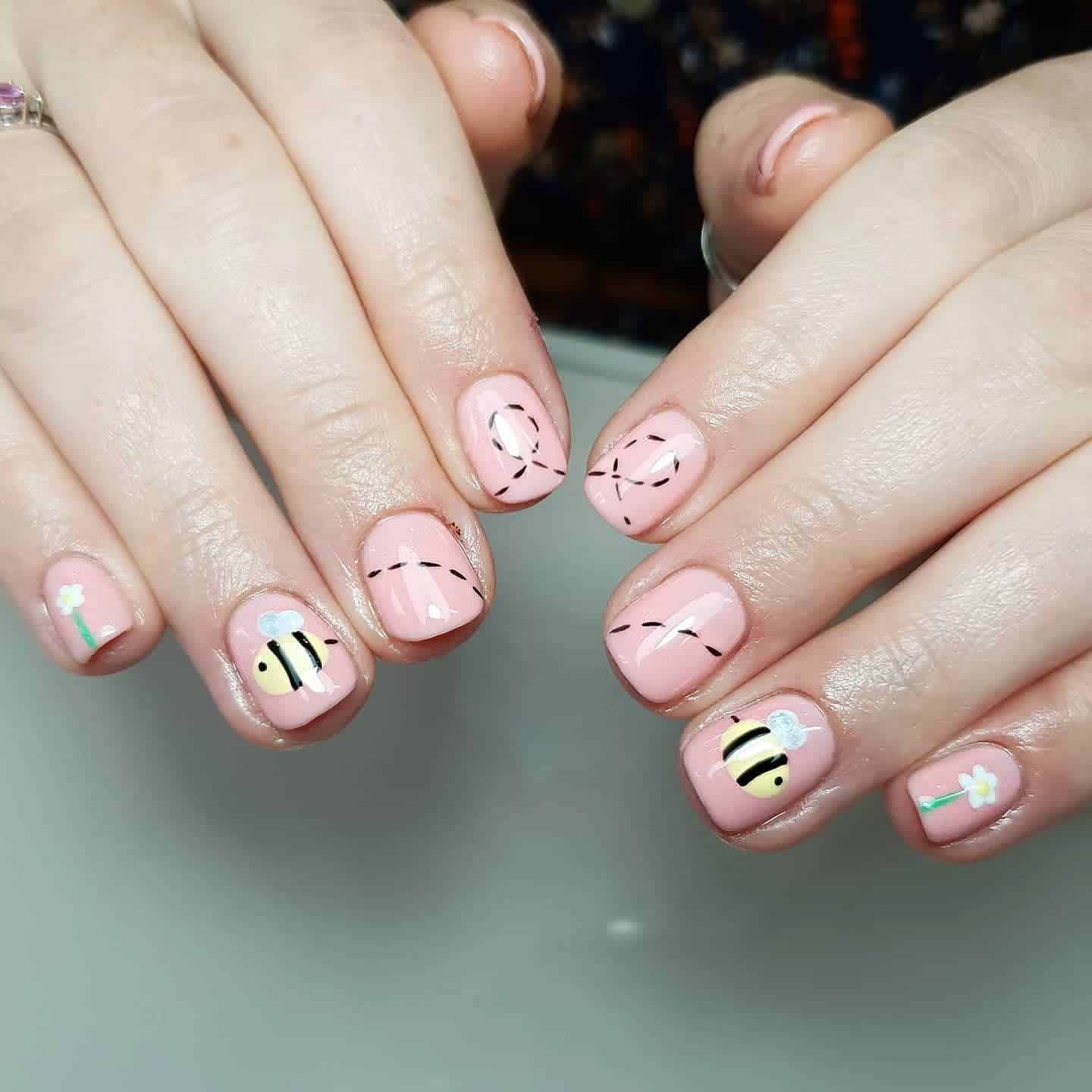 14. Soft Bee Trails on Pink Nails - bee nail ideas