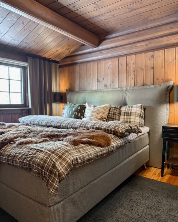 1. Rustic Plaid Warmth in Neutrals - cabin bedroom ideas
