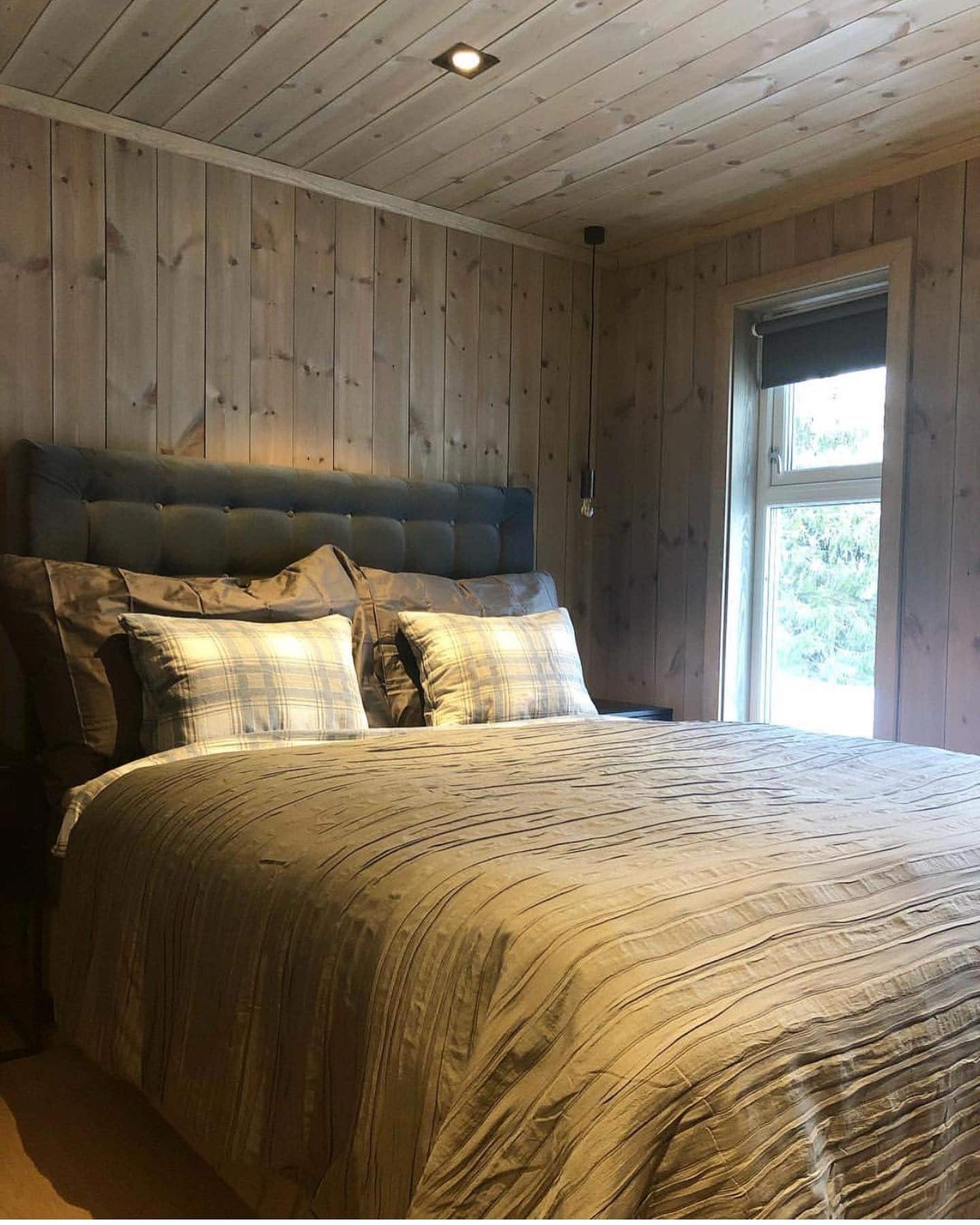 4. Modern Rustic with Subtle Plaid Accents - cabin bedroom ideas