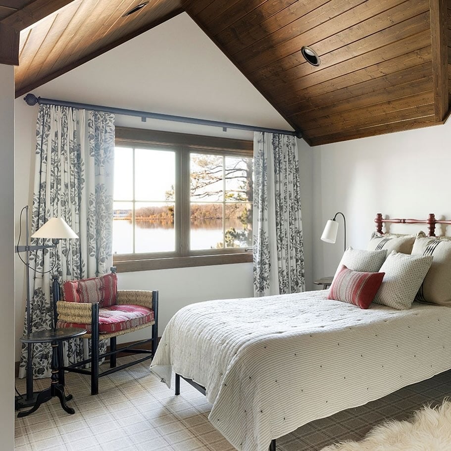 12. Refined Cabin Style with Red Accents - cabin bedroom ideas