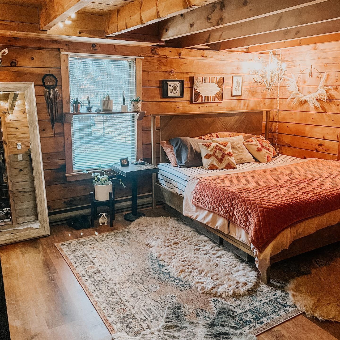 14. Rustic Warmth with Burnt Orange Layers - cabin bedroom ideas