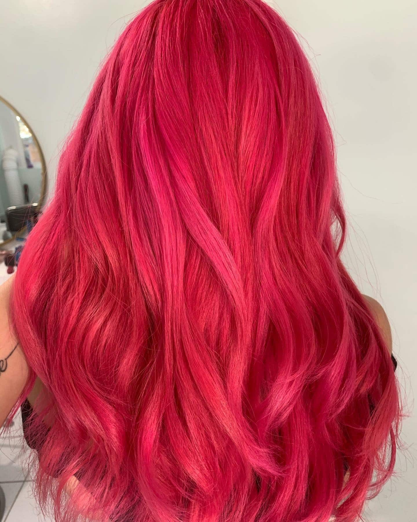 1. Radiant Raspberry Waves - Hot Pink Hair Color
