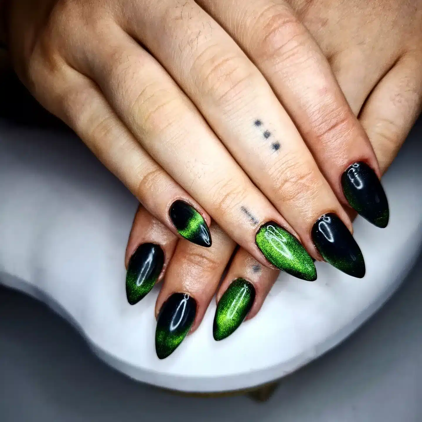 6. Green Cat-Eye Ombre - black and green nail ideas
