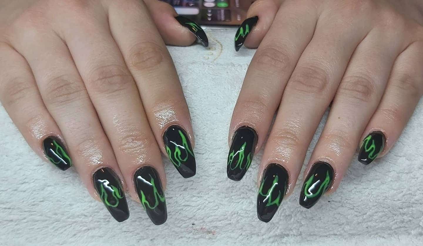 11. Green Flame Coffin Nails - black and green nail ideas