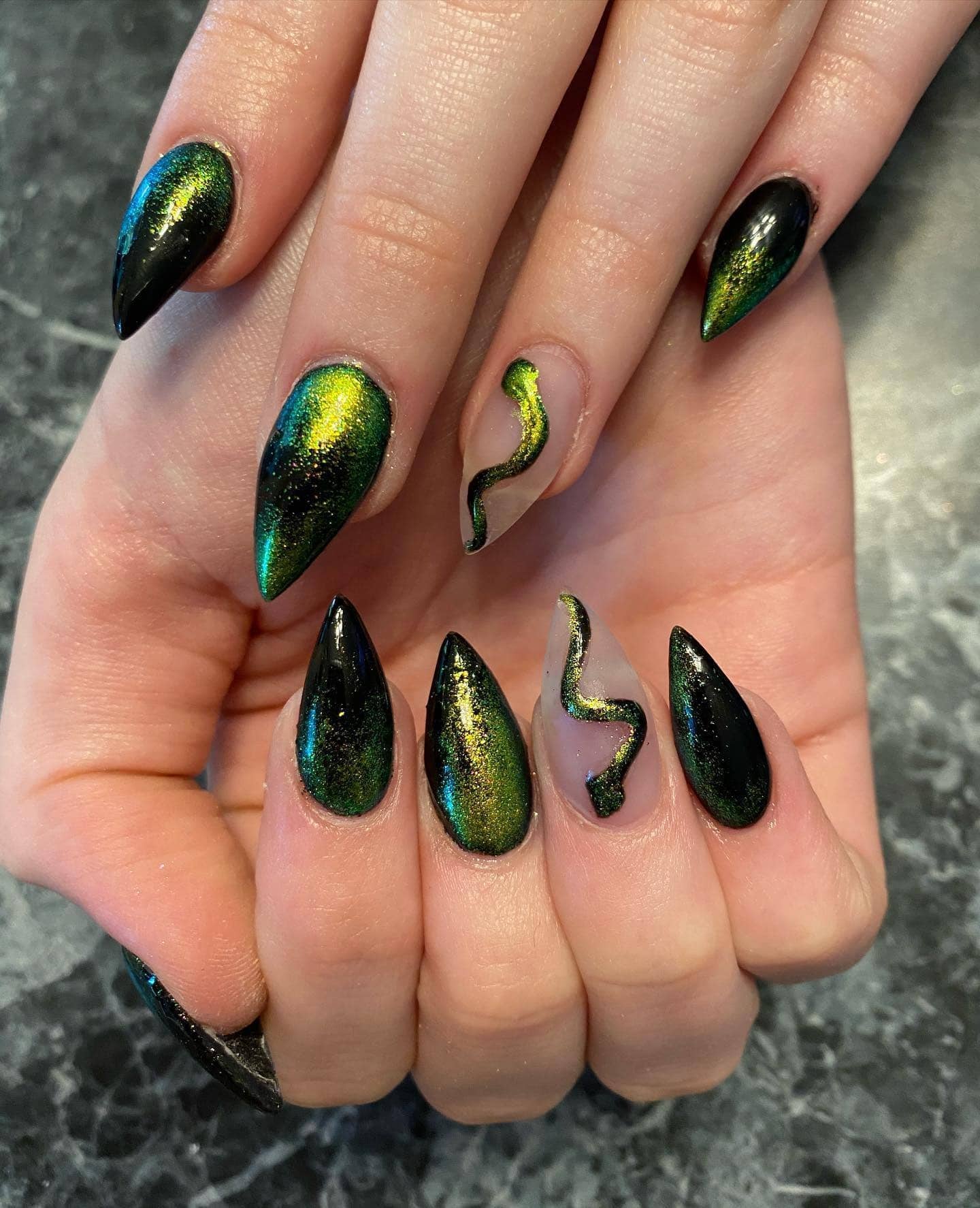 12. Iridescent Stiletto Ombre - black and green nail ideas