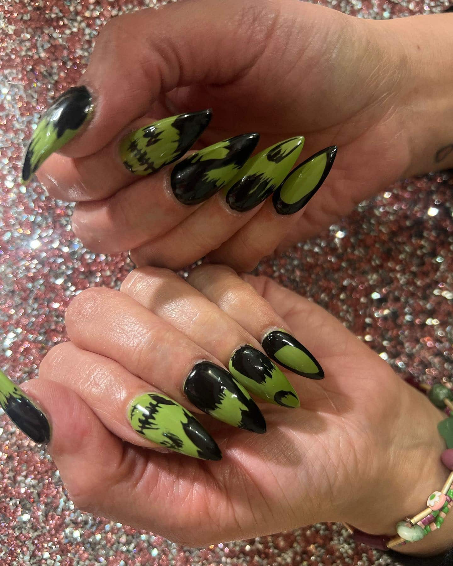 13. Electric Green Abstract Tips - black and green nail ideas