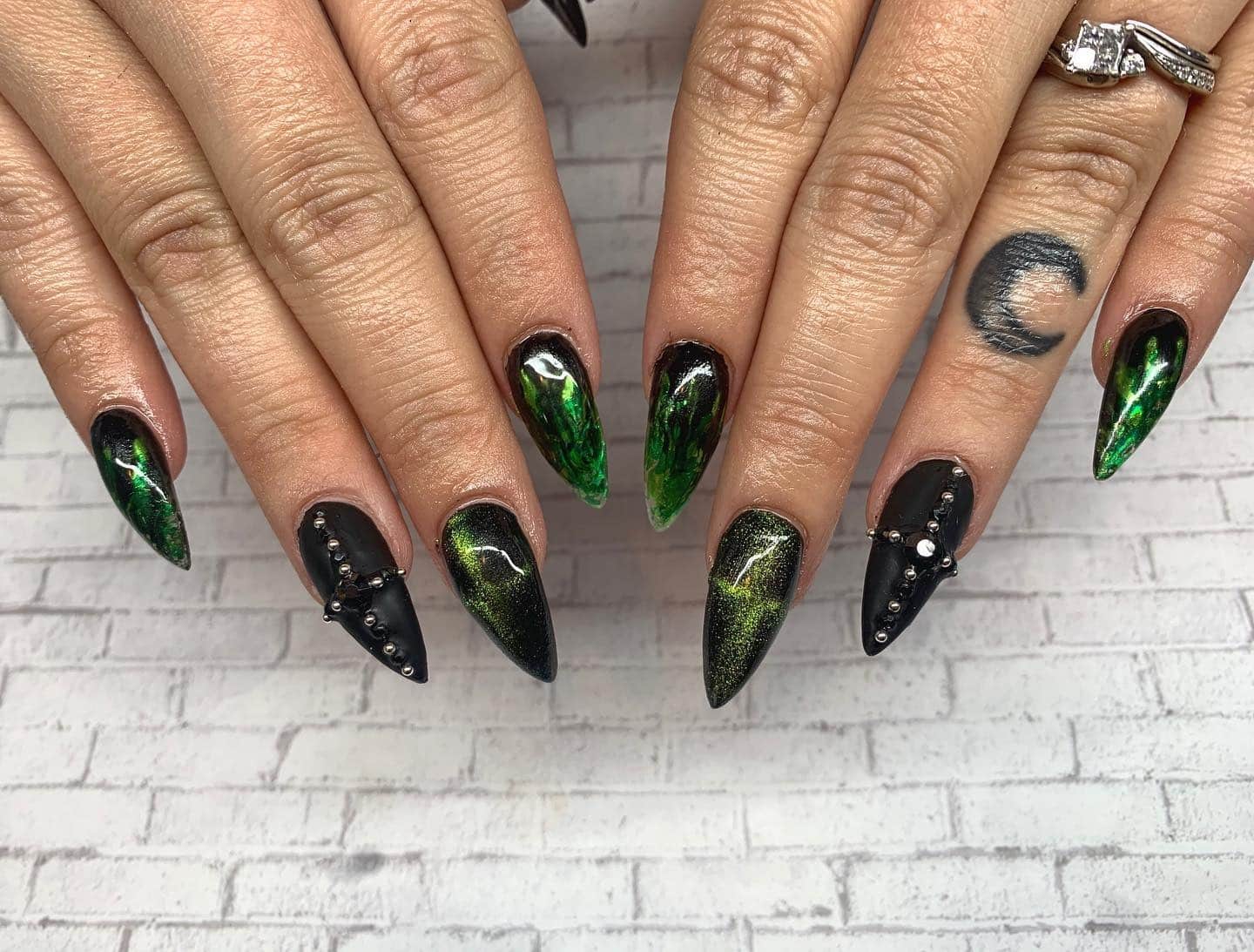 16. Gemstone Green Embellished Nails - black and green nail ideas