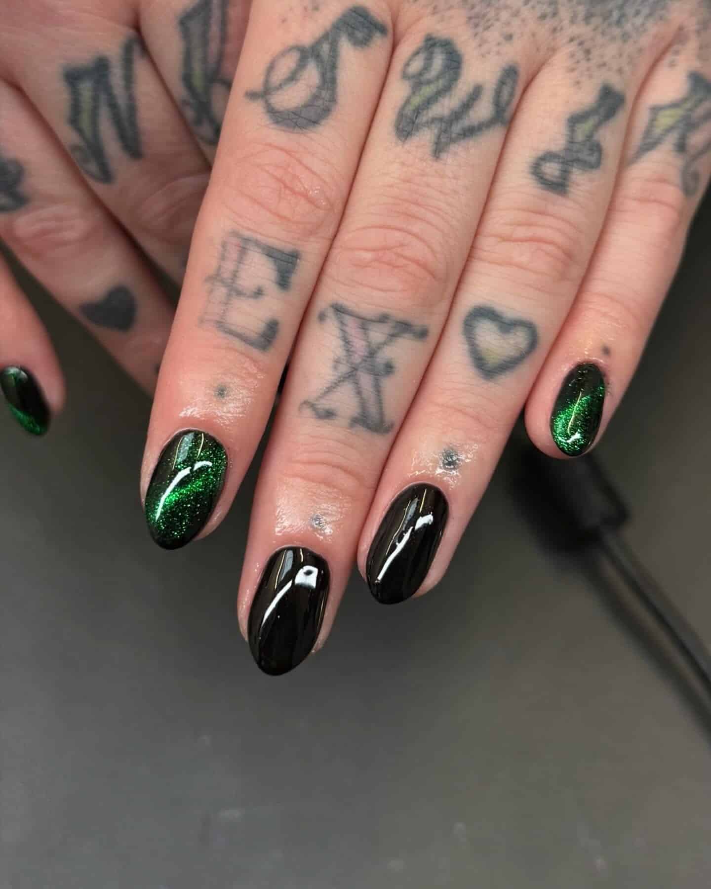 18. Subtle Green Sparkle Short Rounds - black and green nail ideas