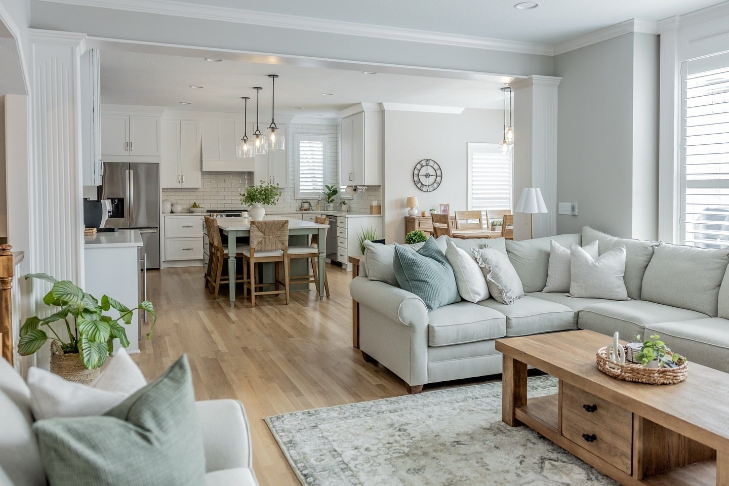 6. Fresh Transitional Charm with Soft Green Accents - kitchen and living room ideas