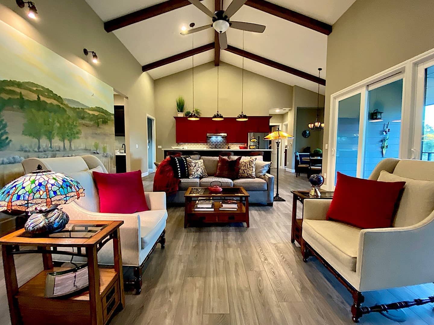 13. Rustic Charm with Red Accents and Exposed Beams - kitchen and living room ideas