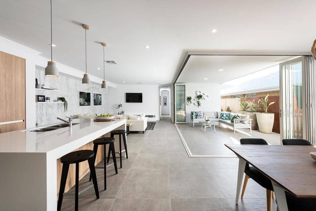 21. Indoor-Outdoor Flow with Stone and Wood Accents - kitchen and living room ideas