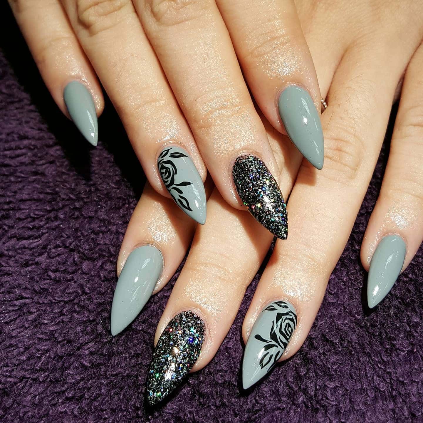 1. Grey Roses with Glitter Accent - black and grey nail ideas