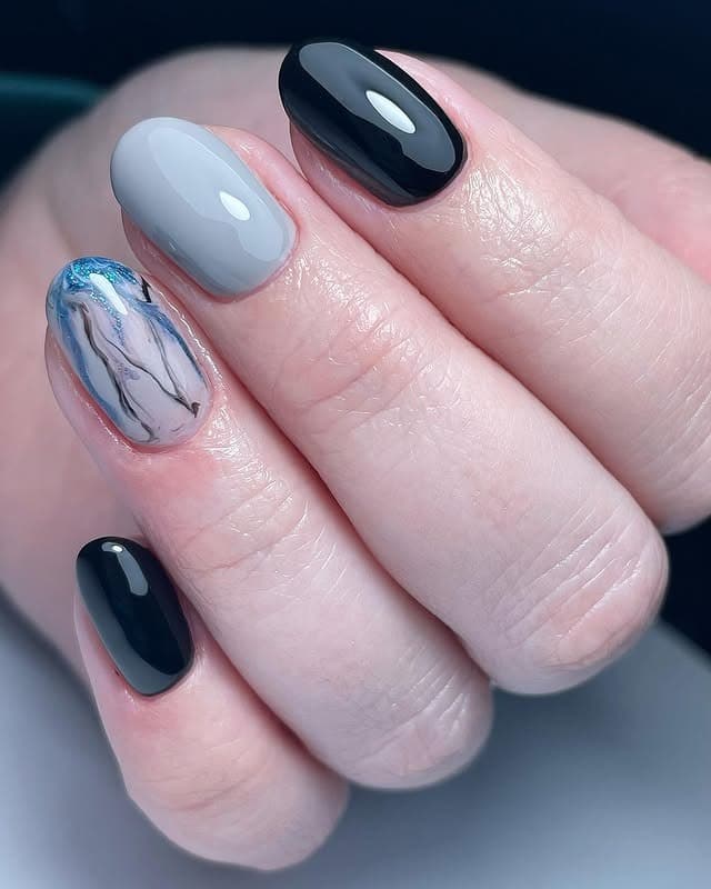 3. Marble Accent with Glossy Grey and Black - black and grey nail ideas