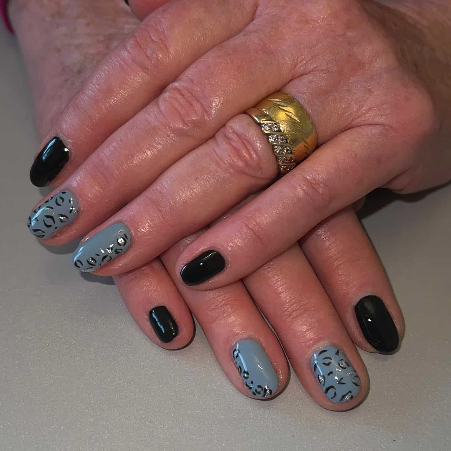 5. Black and Grey Leopard Contrast - black and grey nail ideas