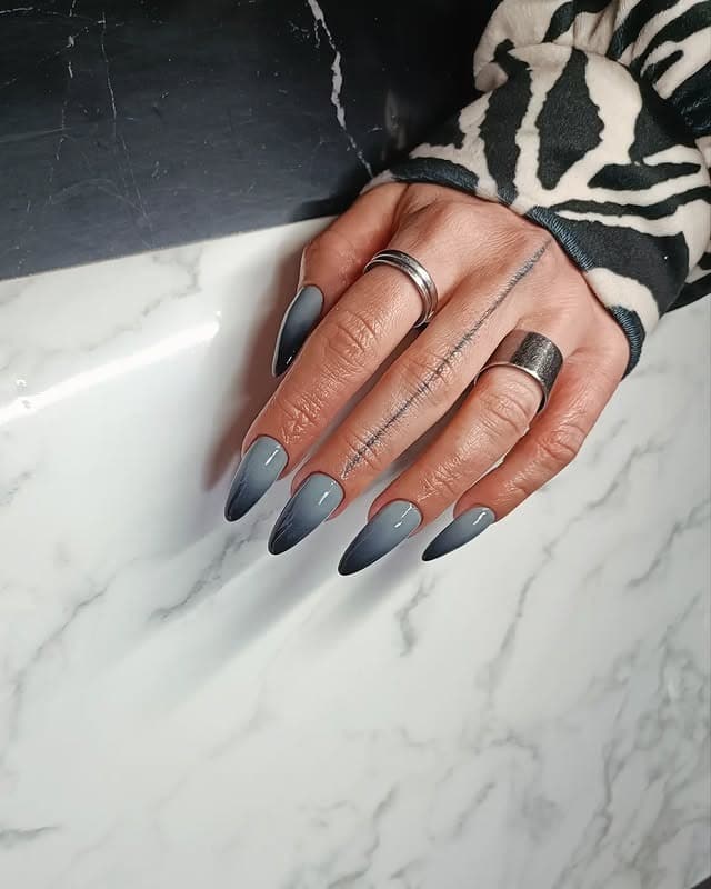 7. Ombre Grey Stilettos - black and grey nail ideas
