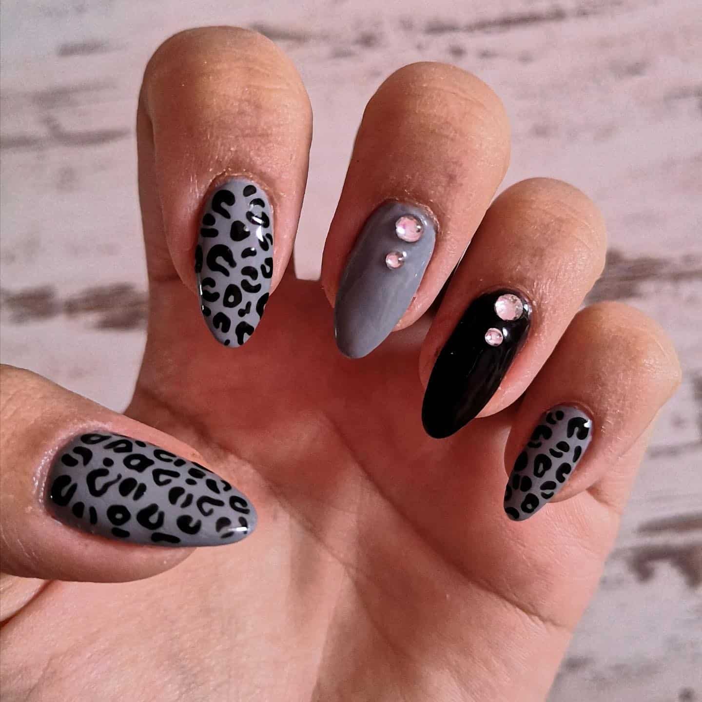 19. Leopard Print with Rhinestone Accents - black and grey nail ideas