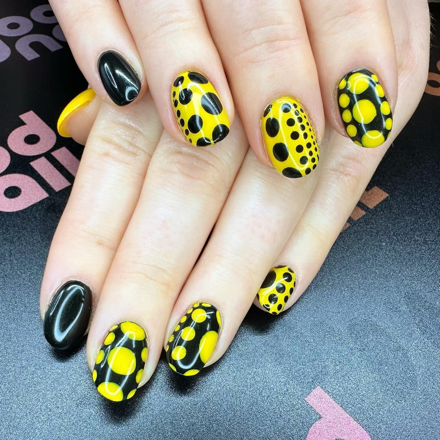 3. Playful Polka Dot Contrast - black and yellow nail ideas