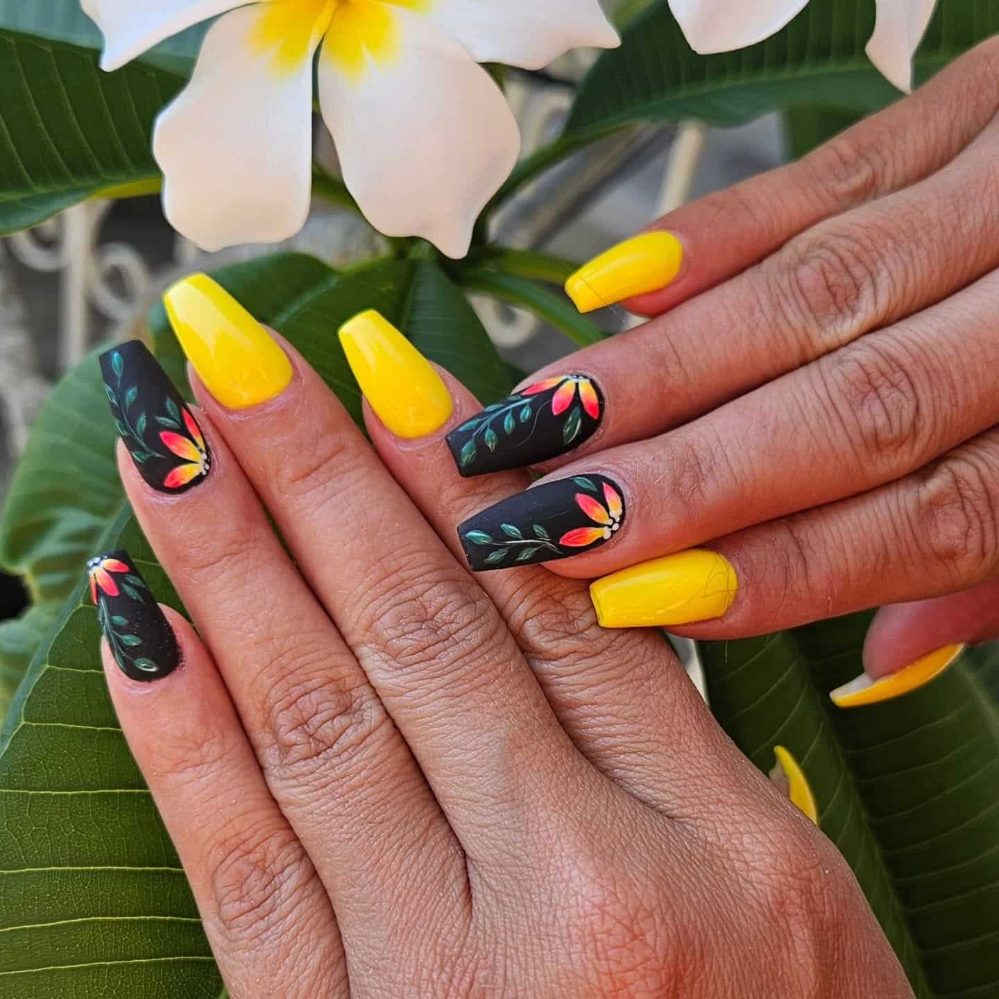 4. Floral Accent Yellow Nails - black and yellow nail ideas