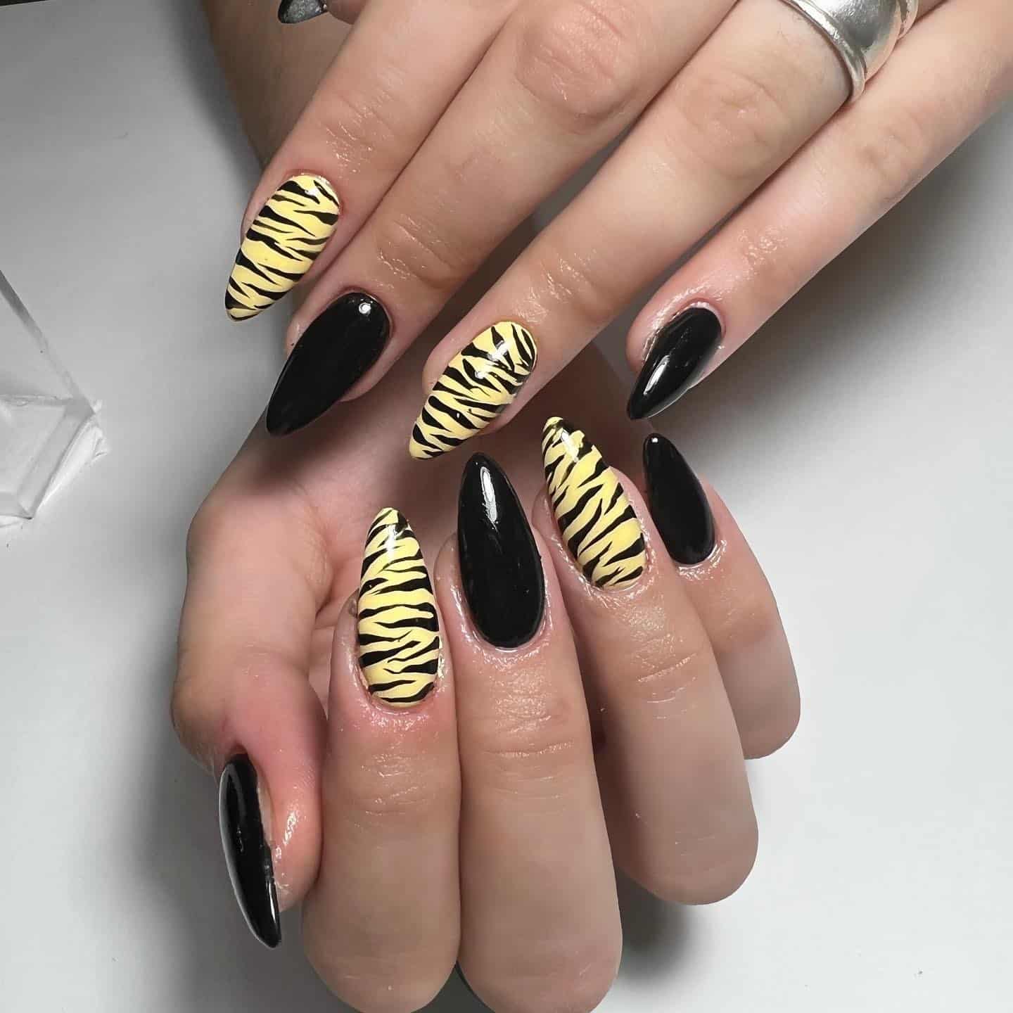 5. Zebra-Inspired Yellow and Black Nails - black and yellow nail ideas