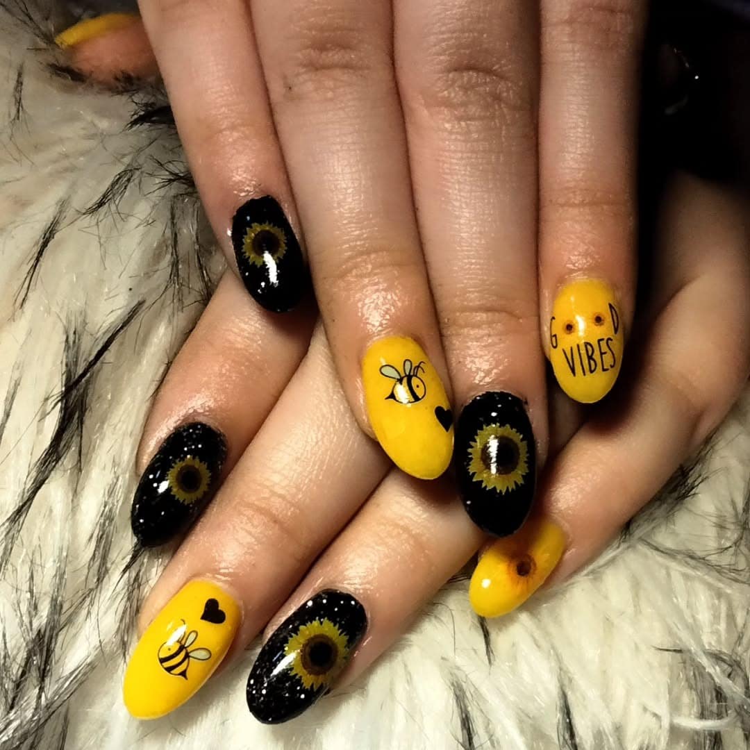 7. Good Vibes Bee-Themed Nails - black and yellow nail ideas