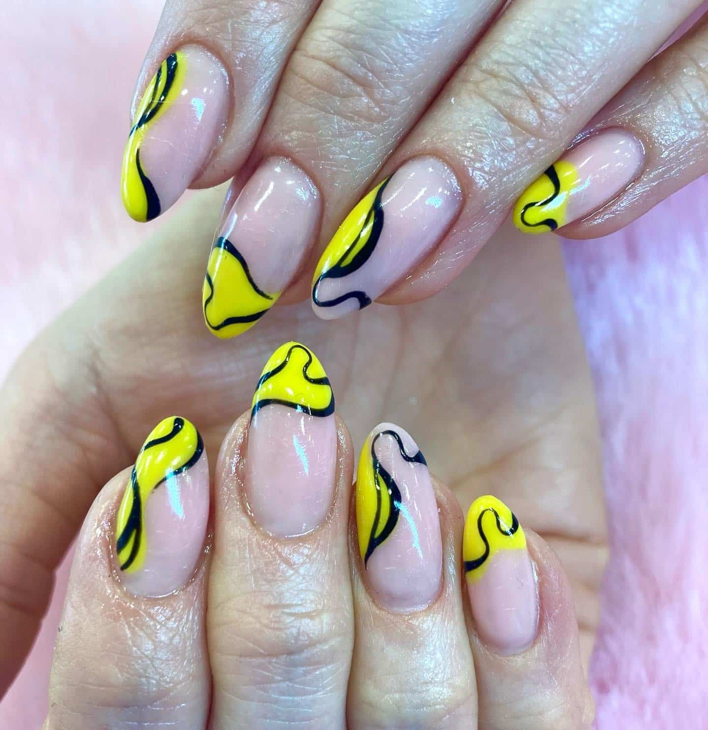 10. Wavy Yellow and Black Abstract Nails - black and yellow nail ideas