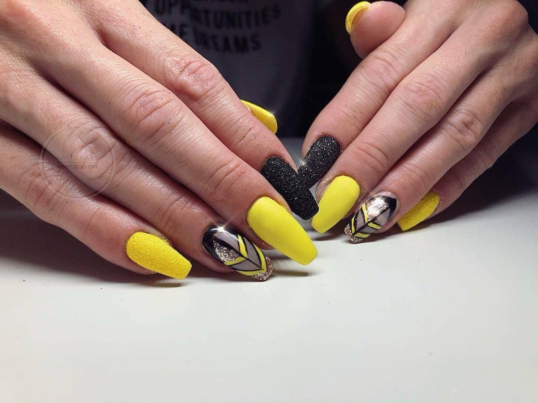 13. Matte and Textured Yellow with Black Accent - black and yellow nail ideas