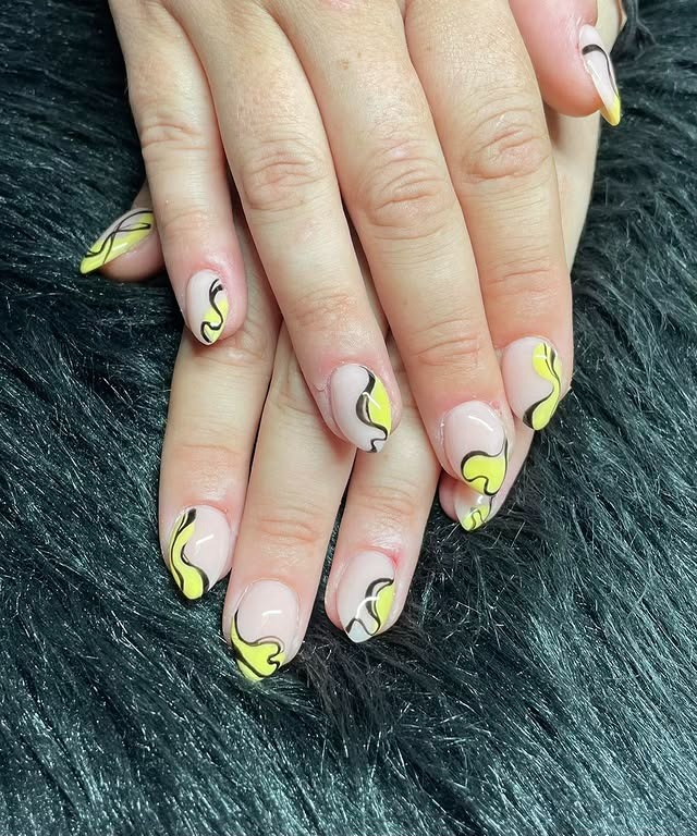 20. Yellow and Black Abstract Waves - black and yellow nail ideas