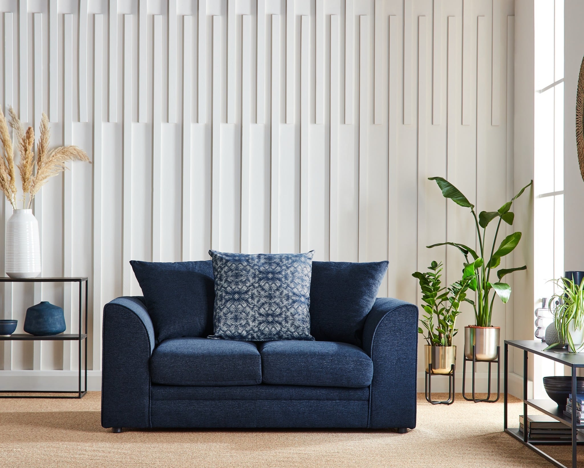 7. Compact Chic with Natural Accents - navy blue couch living room ideas