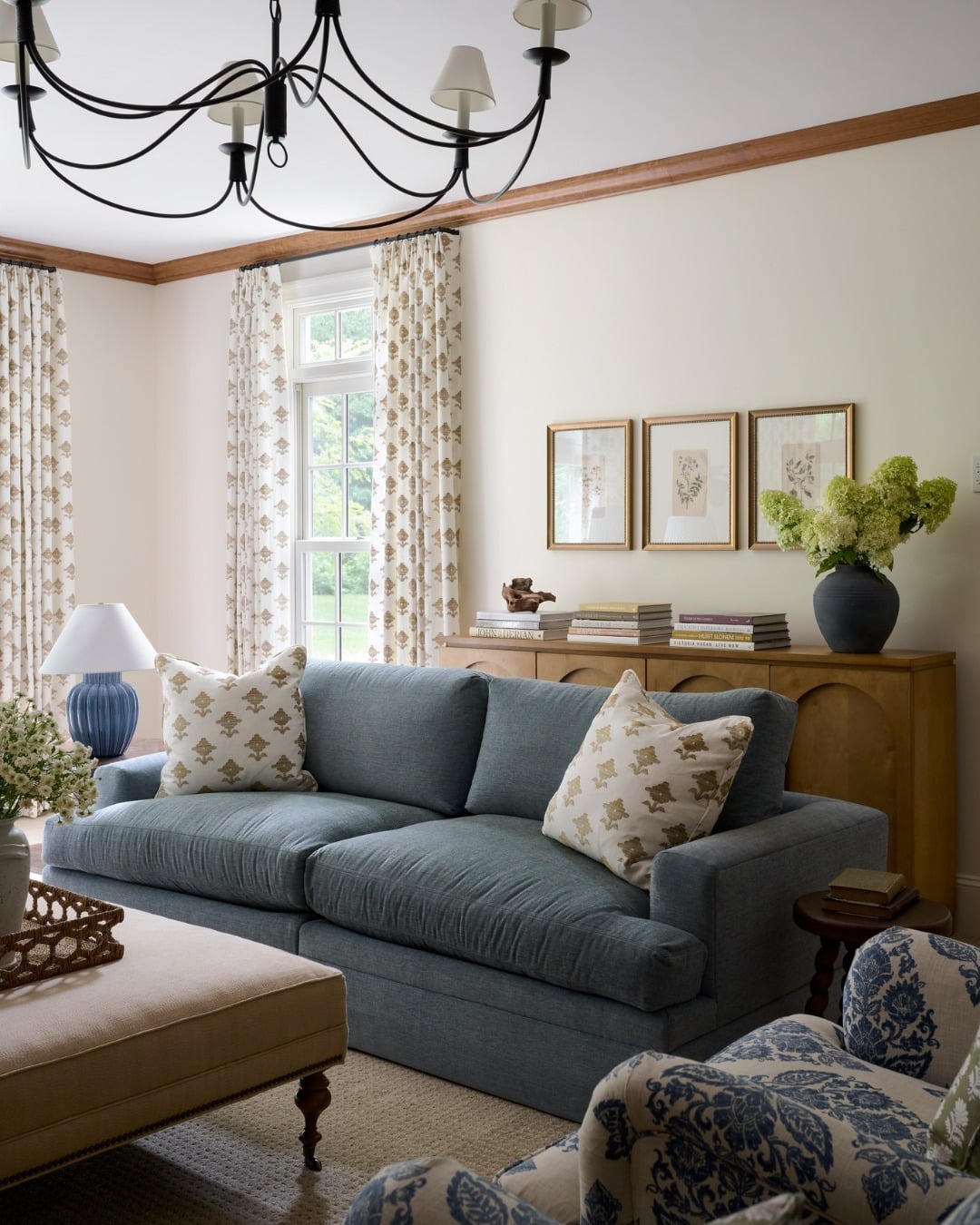 11. Traditional Comfort with Botanical Touches - navy blue couch living room ideas