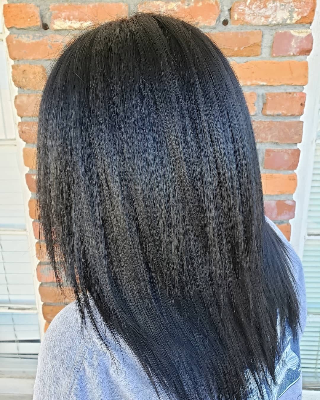 7. Layered Straight Style in Soft Black - Soft Black Hair Color