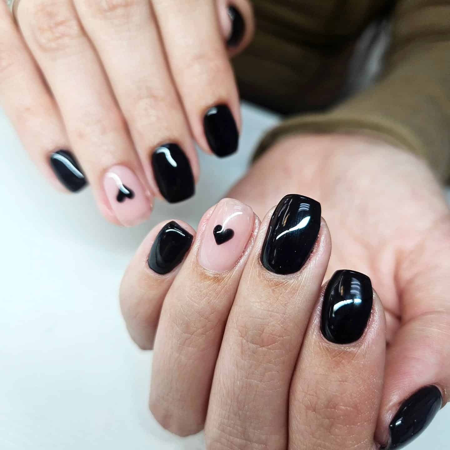 1. Classic Black with Minimal Heart Accent - black valentine nail ideas