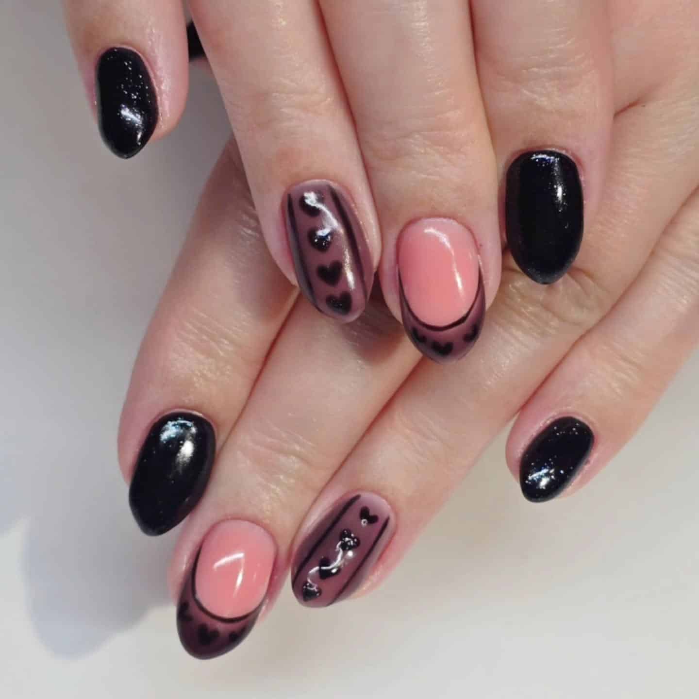 2. Romantic Black Heart Detailing - black valentine nail ideas