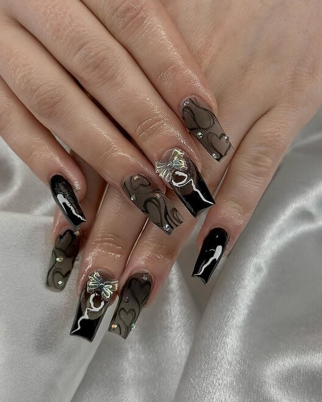 3. Luxe Black Hearts with Bow Embellishments - black valentine nail ideas