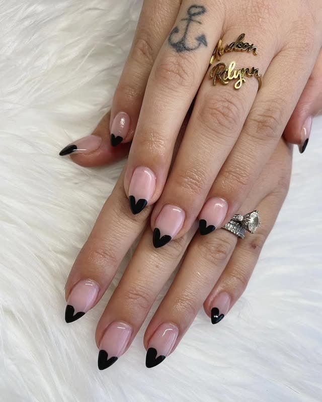 9. Black Heart French Tips - black valentine nail ideas