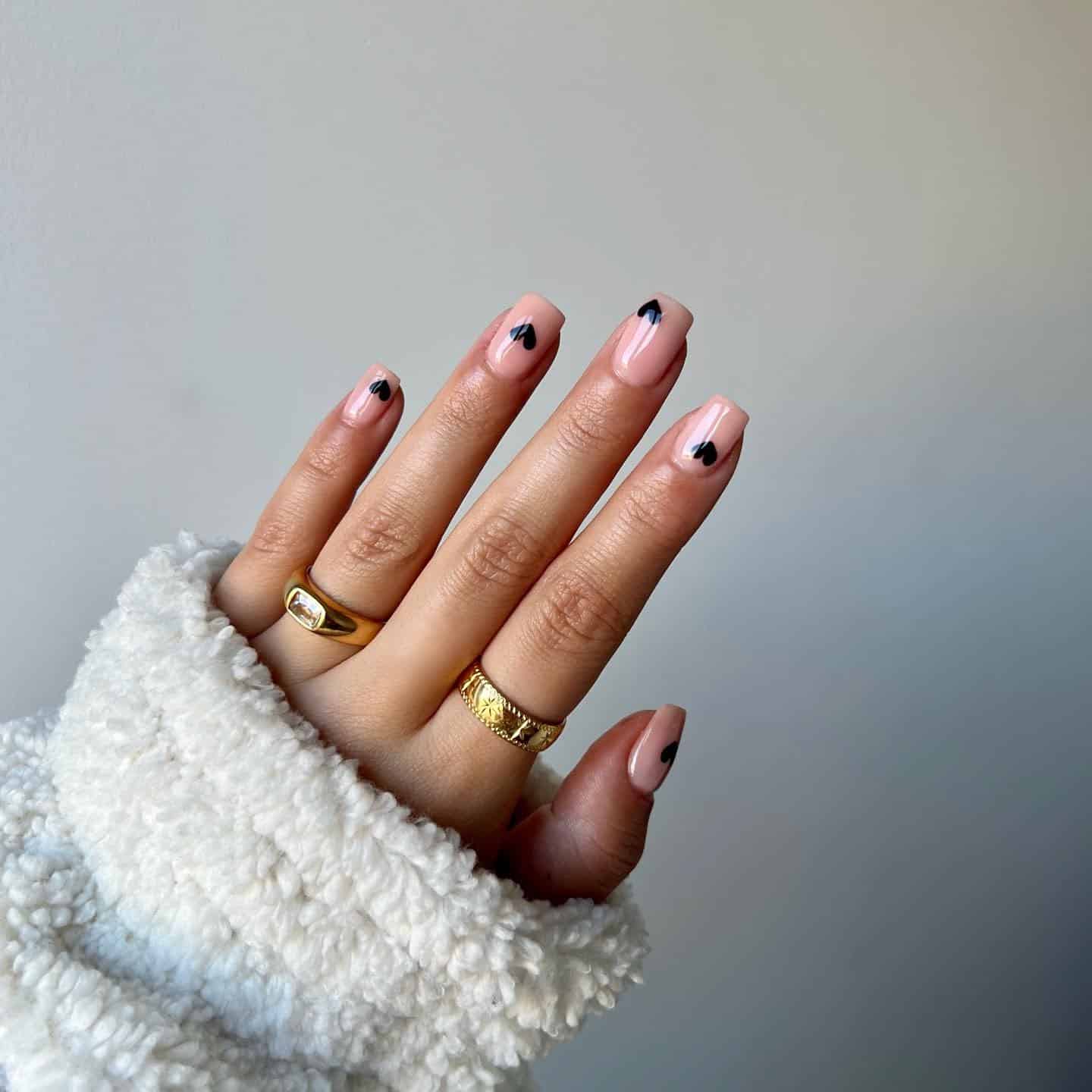 12. Minimalist Black Heart Accents - black valentine nail ideas